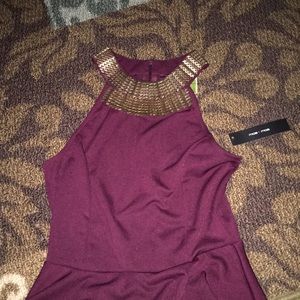 Burgundy peplum top with gold neckline
